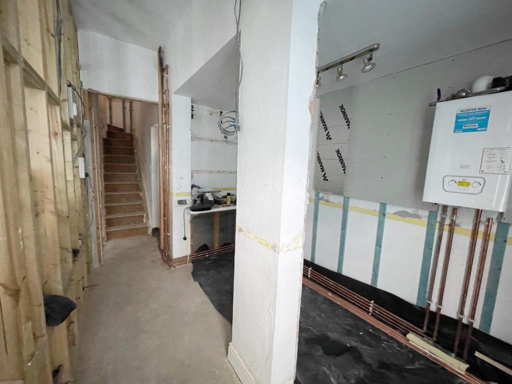 Lot: 173 - FORMER OFFICE WITH PERMITTED DEVELOPMENT TO CONVERT TO RESIDENTIAL DWELLING - Reception area on ground floor with room to the left and stairs